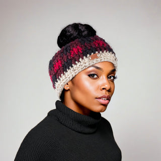 Woman wearing a buffalo plaid, satin lined winter headband in red and black.